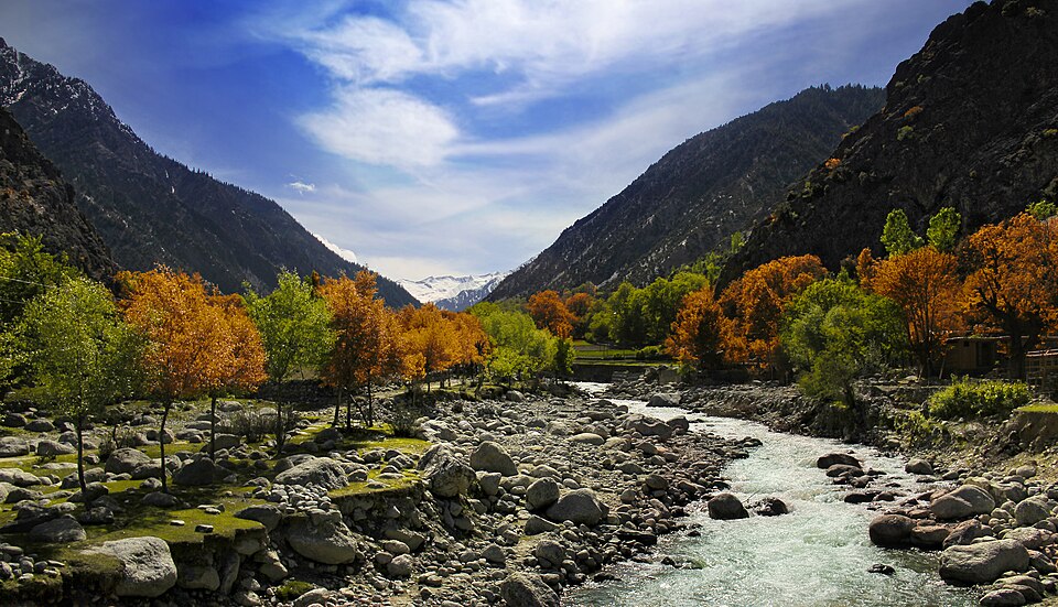 River and autumn trees in Bumburet Valley